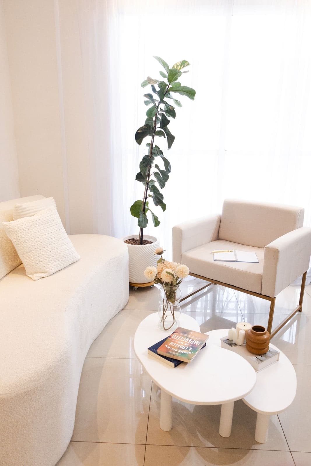 A bright all-white minimalist living room, undecorated